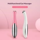 Pink and white electric eye massager for puffiness, designed for soothing eye relief