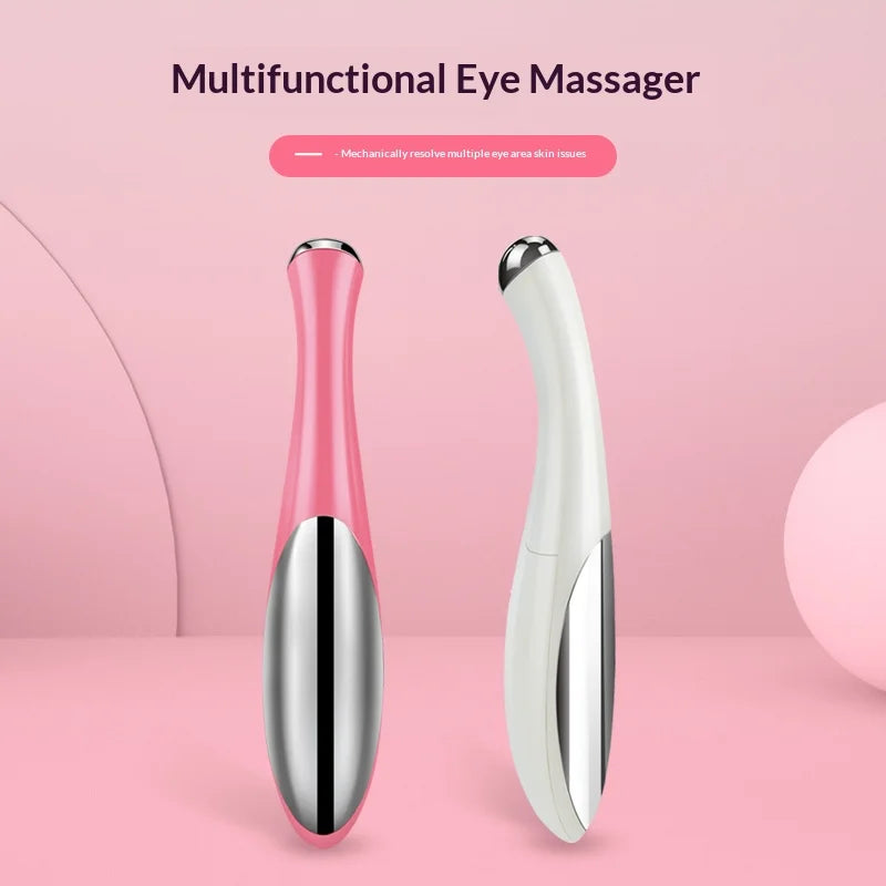 Pink and white electric eye massager for puffiness, designed for soothing eye relief