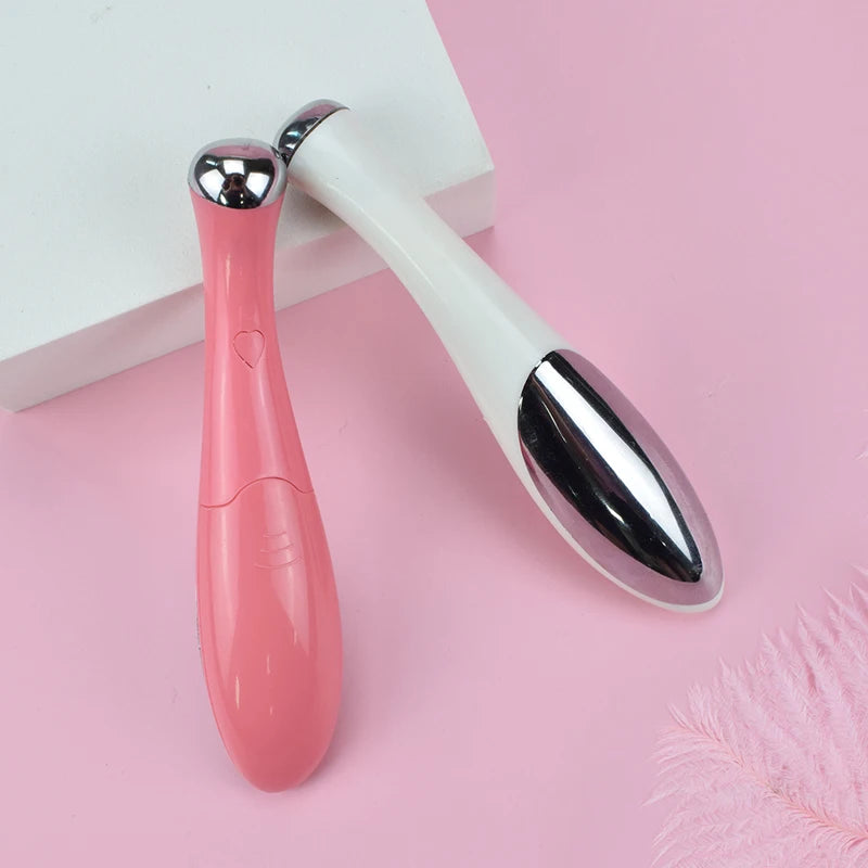 Electric eye massager for puffiness, pink and white design, soothing treatment