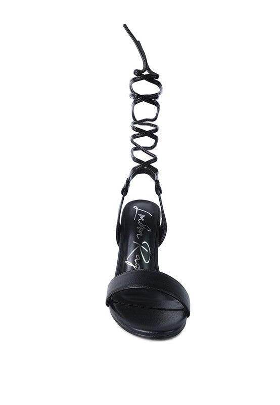 Elegant clear heel shoes with stylish ankle strap and sleek black design for sophisticated occasions