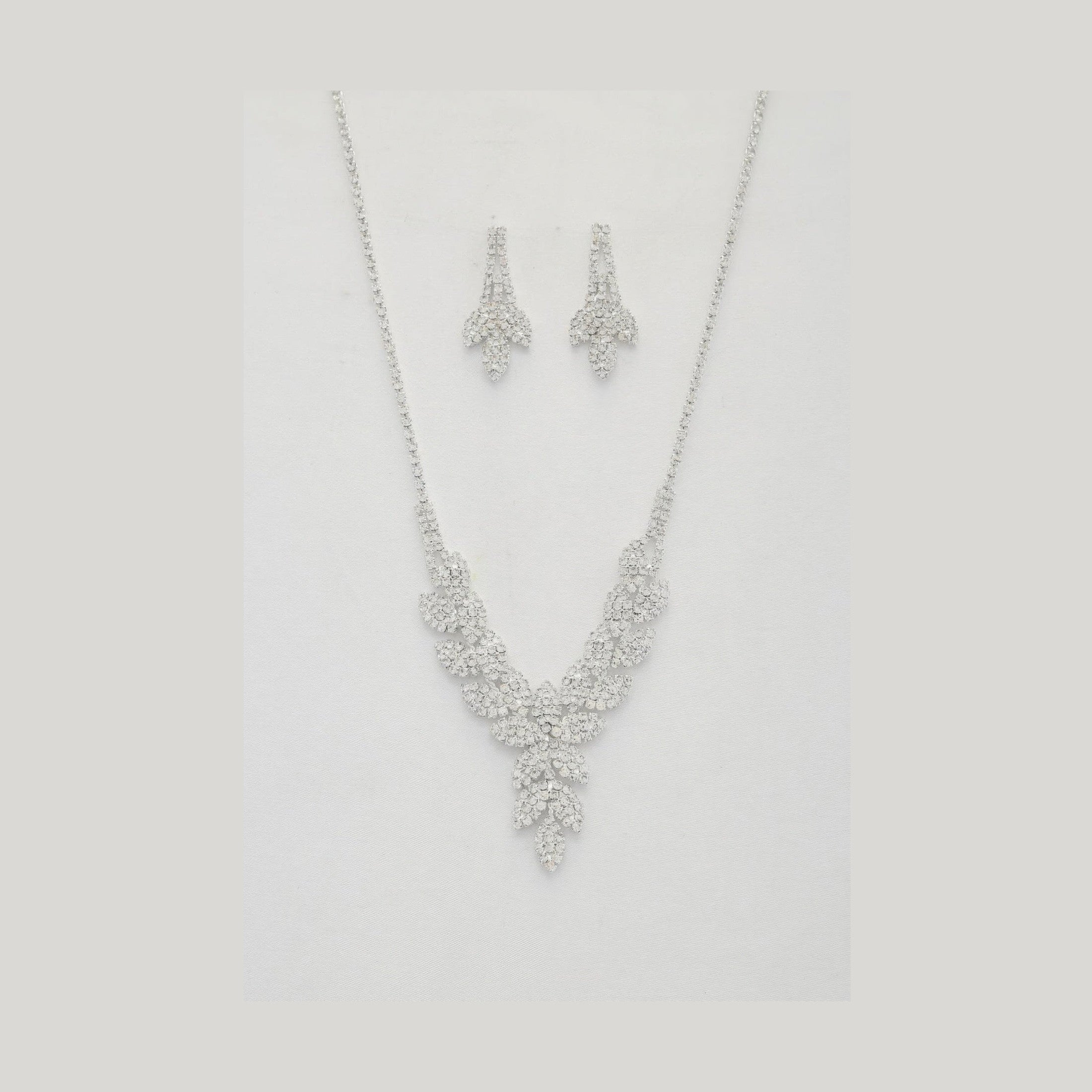 Elegant crystal leaf necklace set with matching earrings for a sophisticated look