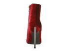 Elegant high heeled boots in red suede with a sleek design and zipper closure for stylish wear