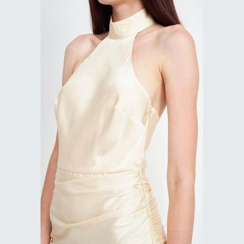 Emory Park elegant summer dress in soft cream fabric featuring a halter neckline and bodycon fit