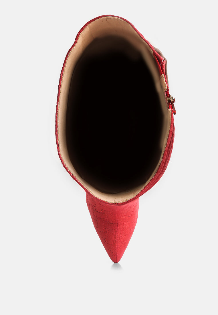 Top view of red embossed high heeled calf boots with sleek design and pointed toe