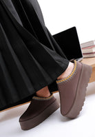 Rag Company embroidered platform slip-on shoes styled with a pleated black skirt for a fashionable look
