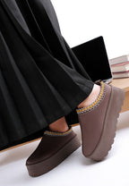 Rag Company embroidered platform slip-on shoes styled with a pleated black skirt for a fashionable look
