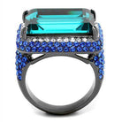 Stunning emerald cut crystal cocktail ring with blue crystals on a sleek black band