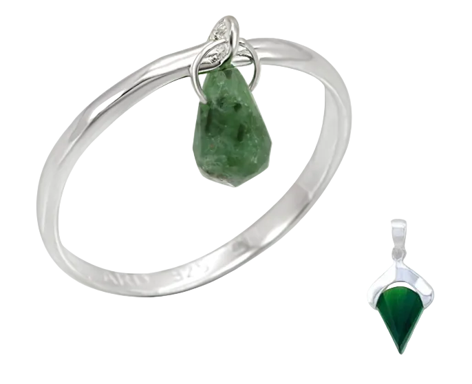 Silver ring with green stone and matching pendant on a white background