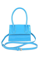 VacationGrabs enamel top handle crossbody bag in vibrant blue with a sleek design and adjustable strap