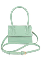 Mint green enamel top handle crossbody bag with a stylish design and adjustable strap for versatility