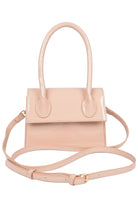 VacationGrabs enamel top handle crossbody bag in soft pink with a detachable strap and sleek design