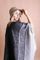 Leto Accessories ethical fashion bucket hat paired with a stylish poncho for a trendy look