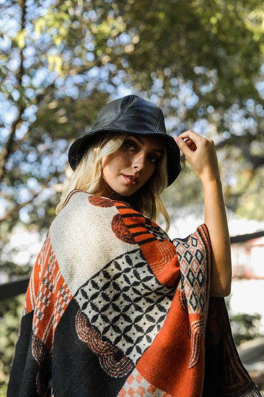 Leto Accessories Ethical Fashion Bucket Hat styled with a patterned wrap in natural outdoor setting