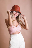 Leto Accessories ethical fashion bucket hat in rust color worn by a stylish model with wavy hair