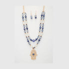 Evil eye hamsa necklace layered set with matching earrings featuring blue and gold accents