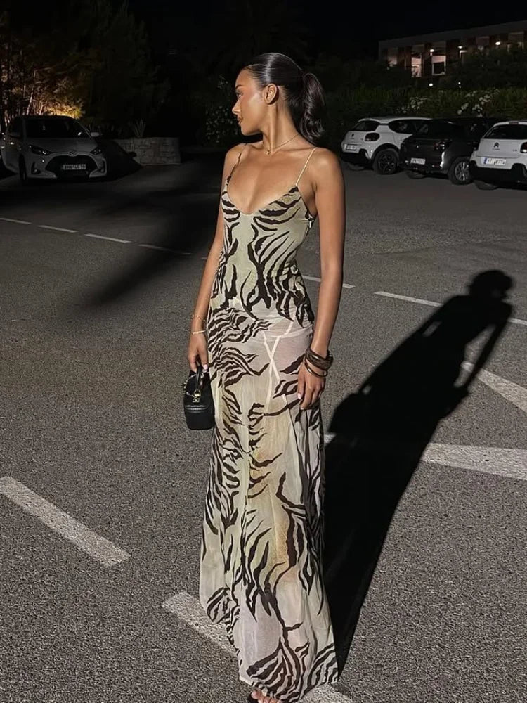 Women's sheer animal print maxi dress for evening outings.