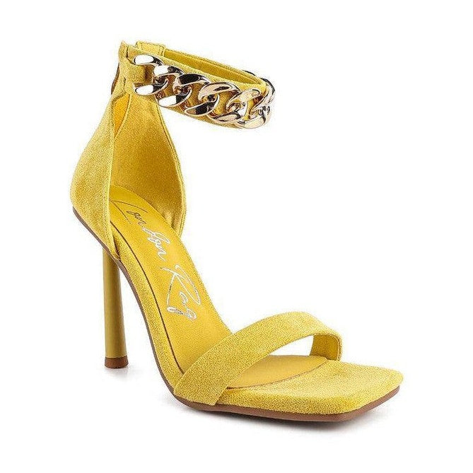 Bright yellow fashion chain strap heels with an ankle strap and stiletto heel for stylish occasions
