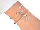 Four elegant fashion charm bracelets for women showcasing diamond and leaf designs on a wrist