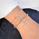 Stylish collection of fashion charm bracelets for women featuring gold-tone designs and unique charms