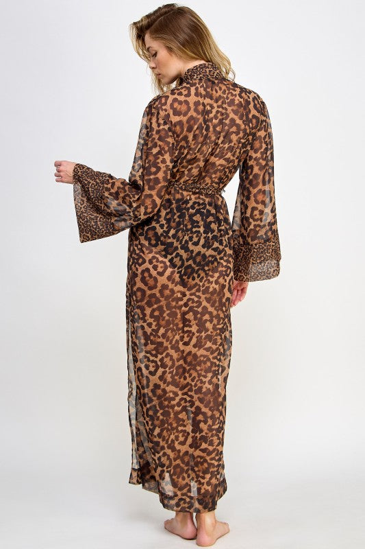 Model wearing a long sheer leopard print womens robe with belt and flared sleeves back view