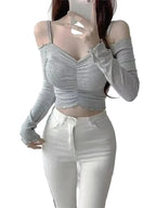 Grey long sleeve off shoulder crop top for women paired with white high waist pants