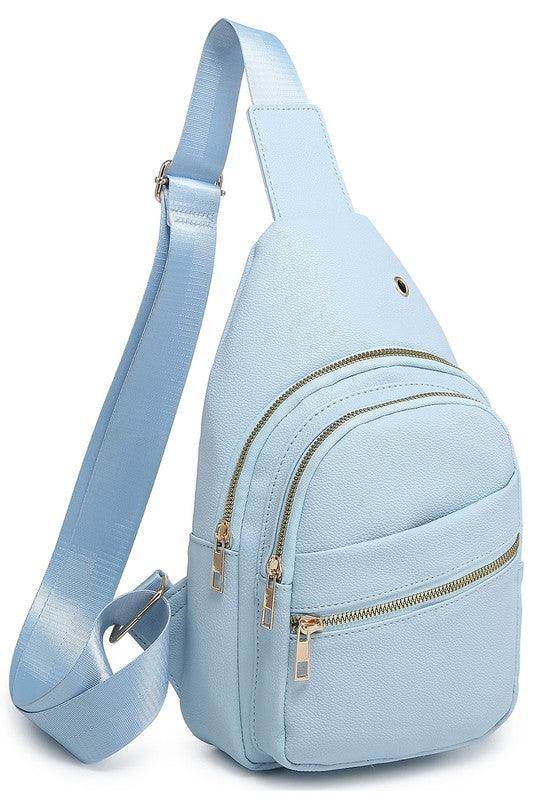 Light blue fashion sling bag for travel with multiple zippered pockets and adjustable strap