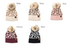 Aili's Corner fashionable animal print beanie collection in beige, taupe, rose, black, and Monaco colors with pom poms