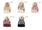 Aili's Corner fashionable animal print beanie collection in beige, taupe, rose, black, and Monaco colors with pom poms