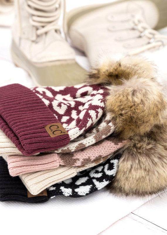 Stylish collection of women's fashionable animal print beanie hats with faux fur pom poms