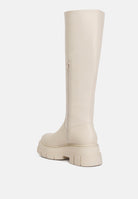 Cream faux leather platform knee boots with a side zipper and chunky sole for stylish comfort
