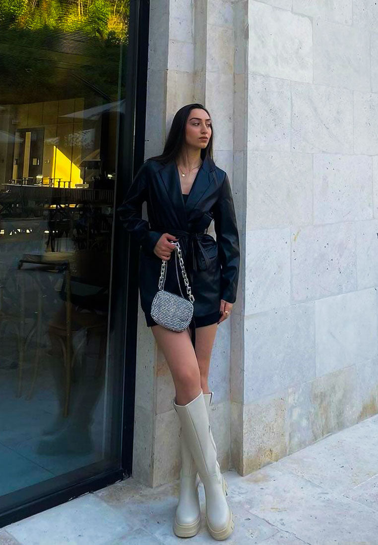 Stylish London Rag International faux leather platform knee boots paired with a chic black outfit