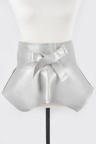 Shiny silver faux leather skirt belt with a stylish bow detail for women's accessories