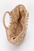 Inside view of a VacationGrabs faux straw tote bag with a spacious tan interior and braided handles
