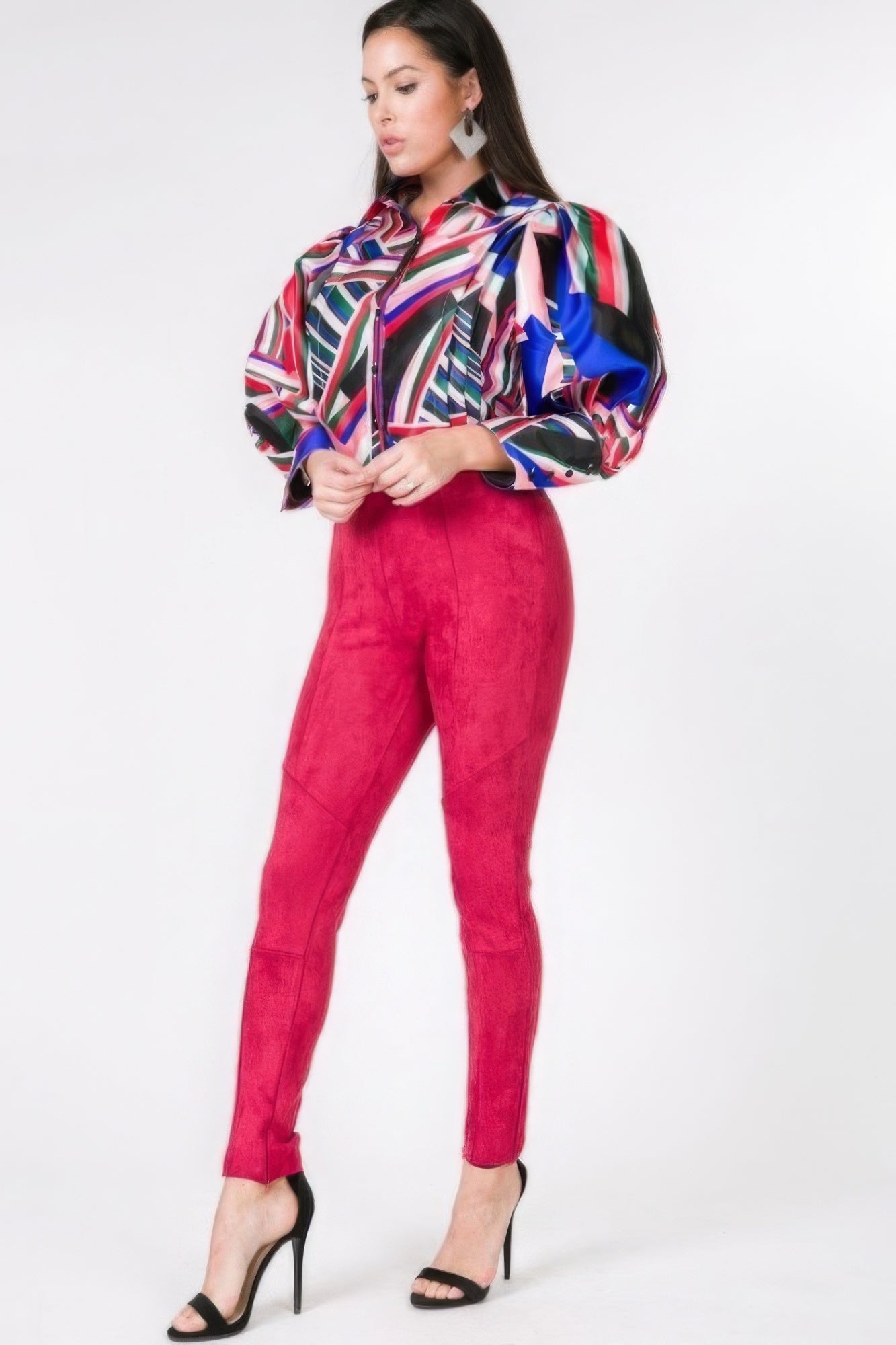 VacationGrabs women's faux suede skinny pants women in bright red paired with a colorful geometric blouse and black high heels