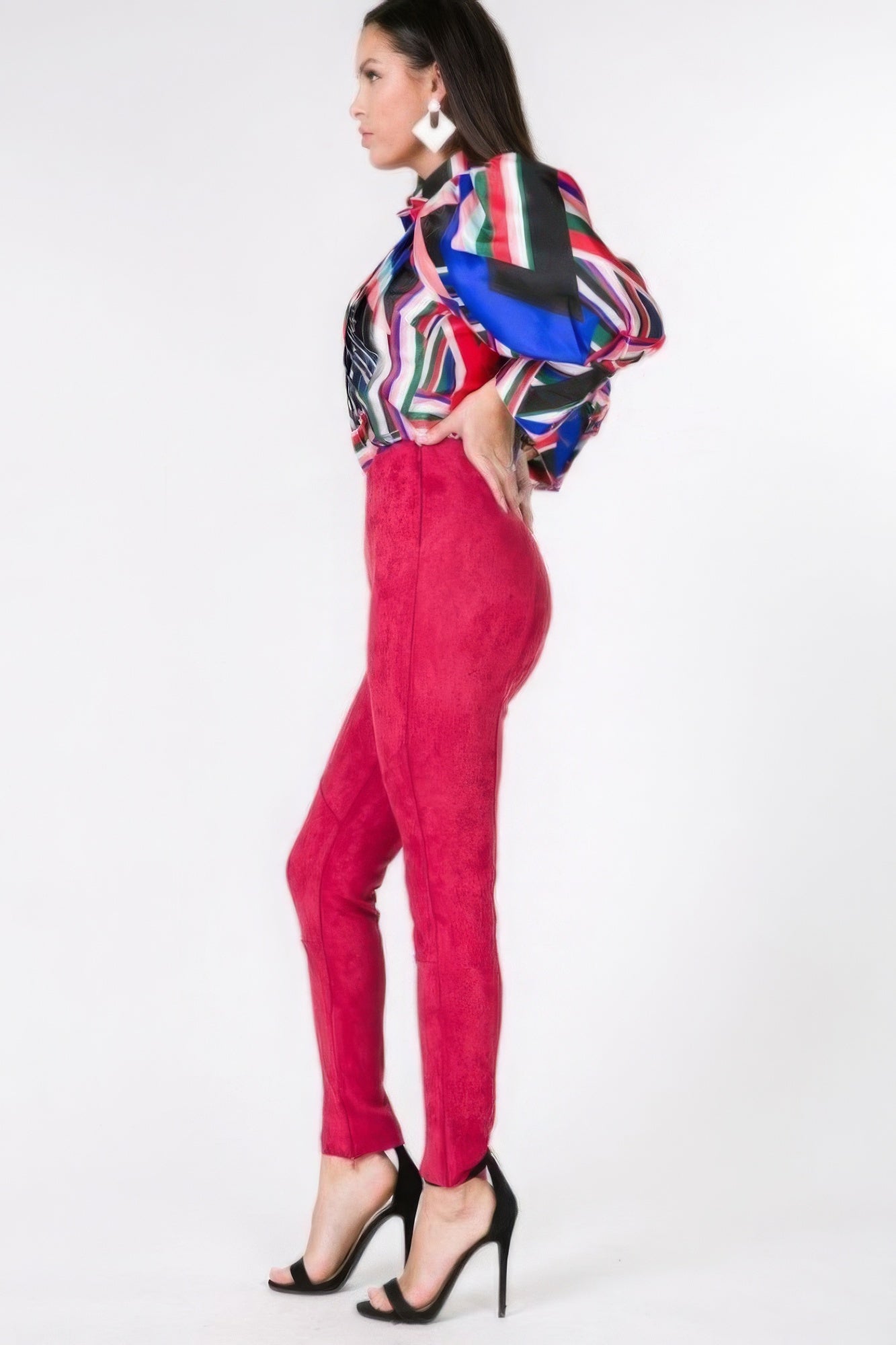 VacationGrabs faux suede skinny pants women in red modeled with colorful blouse and black heels
