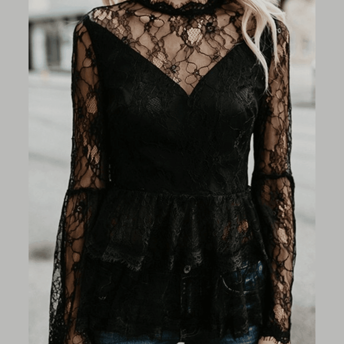 Ivory Felix black lace flare sleeve blouse with a peplum design and v-neckline for a chic look