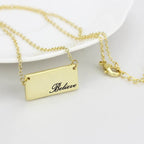 Elegant flash gold brass necklace featuring a rectangular pendant with 'Believe' engraving
