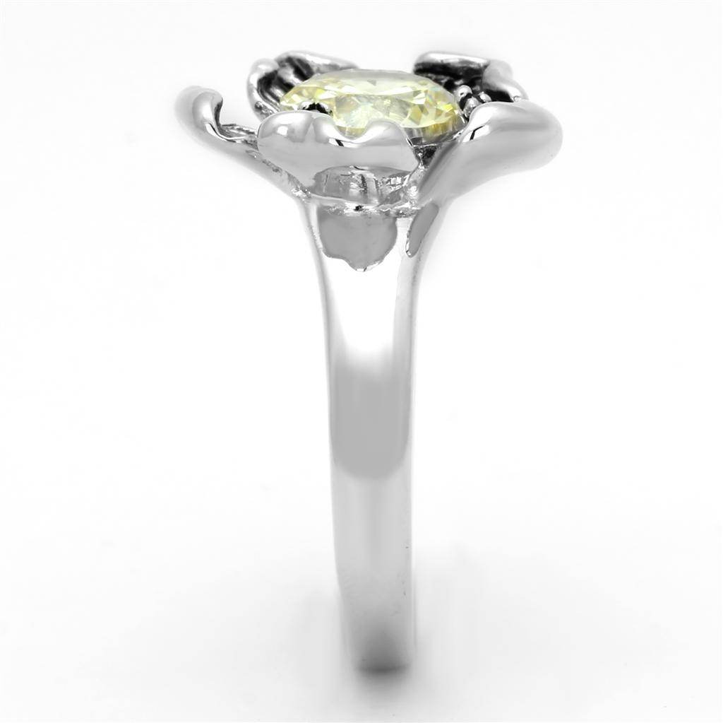 Elegant floral citrine ring with a shiny silver band and a vibrant yellow gemstone