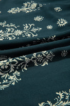 Women's floral dress in teal fabric with white patterns, perfect for casual outings