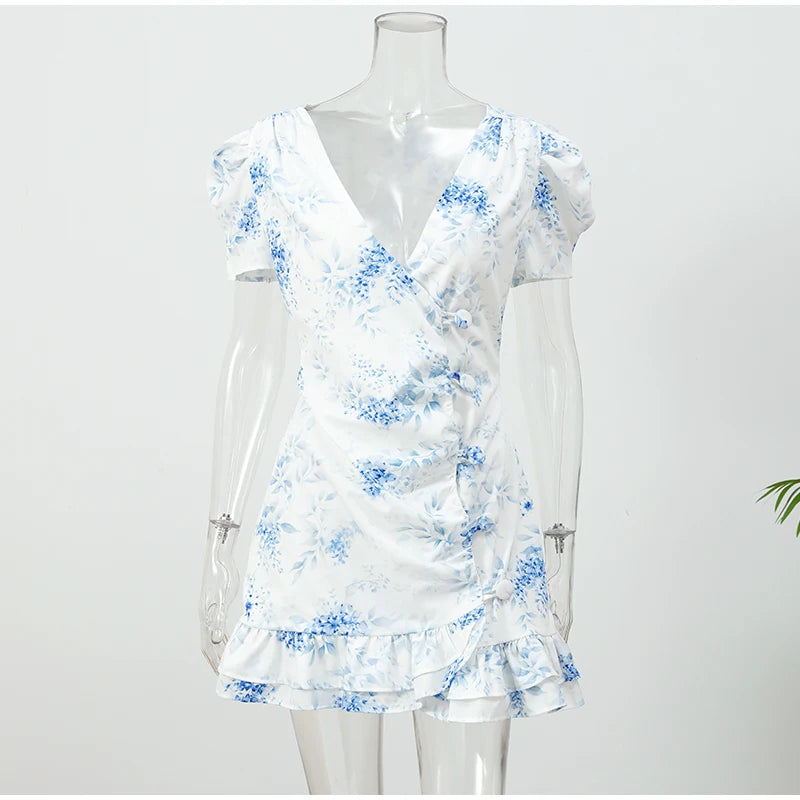 Women's white floral dress with blue accents, perfect for summer outings