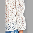 Ivory Felix floral lace blouse for vacation featuring puffed sleeves and intricate lace design