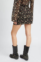 Emory Park floral lace skirt outfit featuring a black floral design and stylish knee-high boots