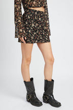 Emory Park floral lace skirt outfit featuring a patterned mini skirt styled with black boots