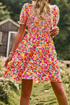 Colorful floral print a line dress with puff sleeves and tiered ruffles for a summer look