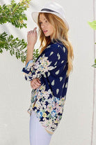 Shopin LA floral roll up sleeve top in navy with vibrant floral patterns for a stylish summer look