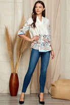 Shopin LA women's floral roll up sleeve top paired with skinny jeans for a casual look