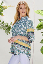 Shopin LA women's floral roll up sleeve top featuring vibrant patterns and a relaxed fit