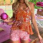 Floral vintage tank top in orange, perfect for summer gatherings