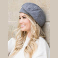 Stylish fold over beret for travel in gray, perfect accessory for chic outdoor looks