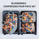 Colorful foldable packing cubes for travel in a suitcase